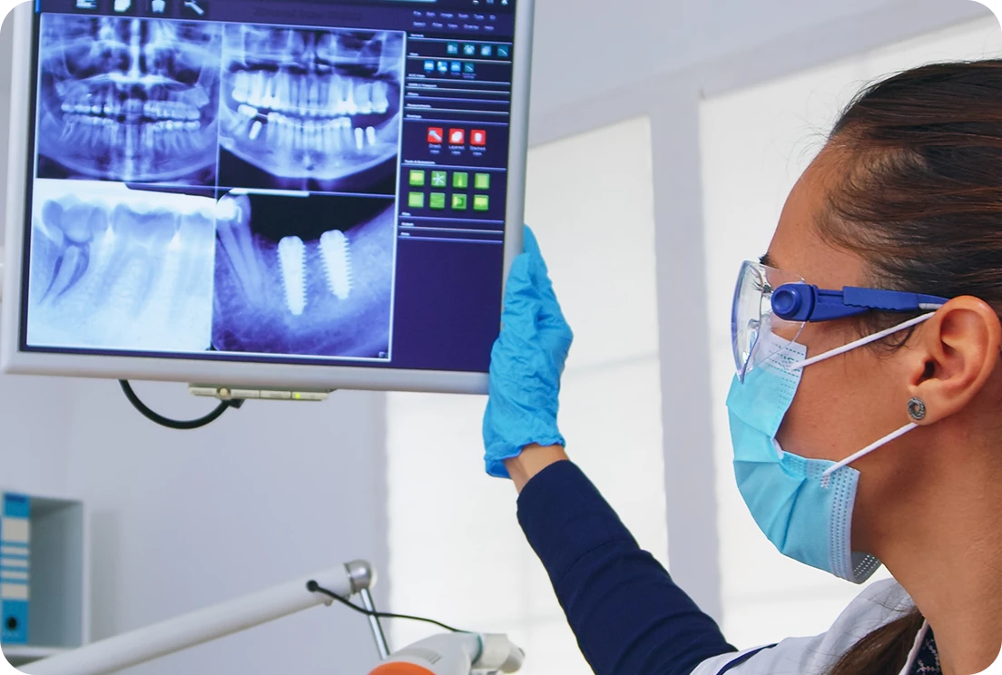 dentist checking the result of teeth scan