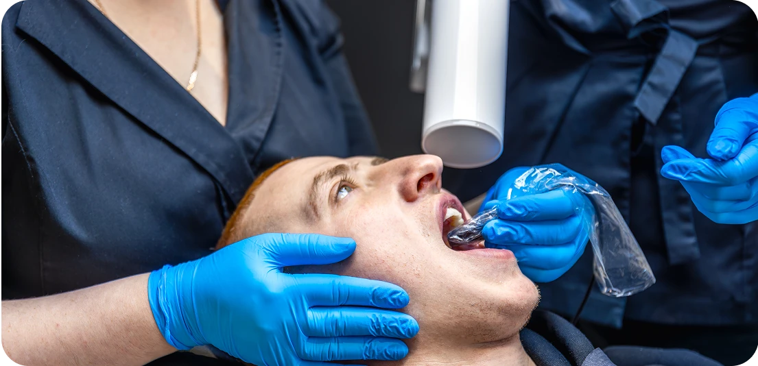 patient being treated by the dentist