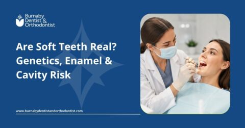 Dentist examining a patient’s teeth while explaining enamel strength and cavity risk factors related to “soft teeth” concerns