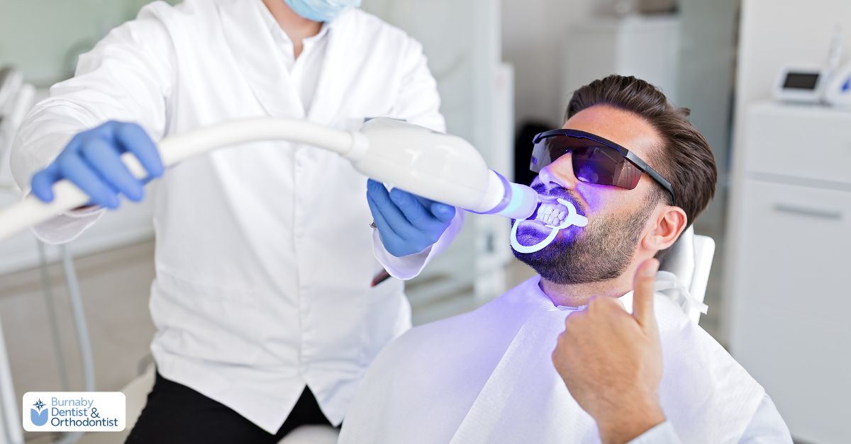  A dentist performing controlled teeth whitening procedure