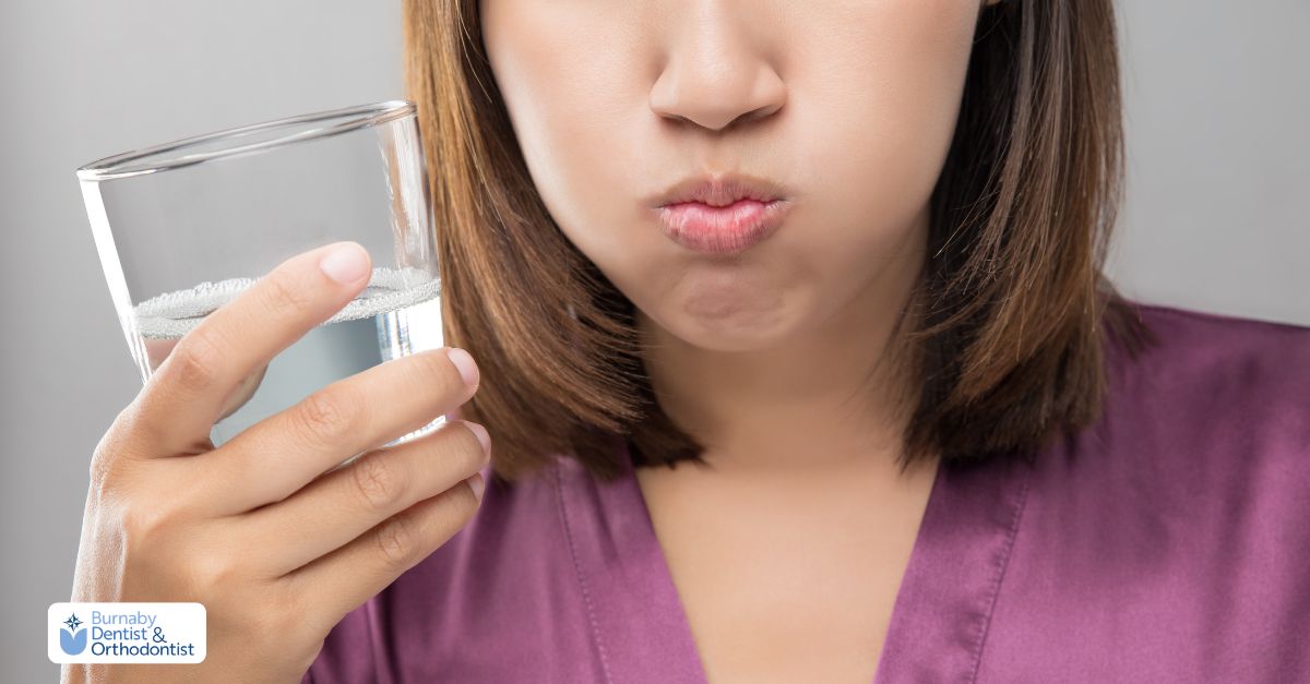 Person using warm salt water rinse to soothe irritated gums after flossing