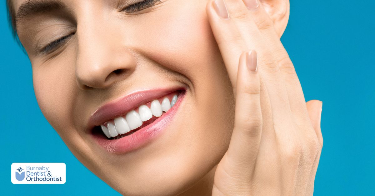 A woman with a bright smile showcasing her white teeth and a front dental bridge.